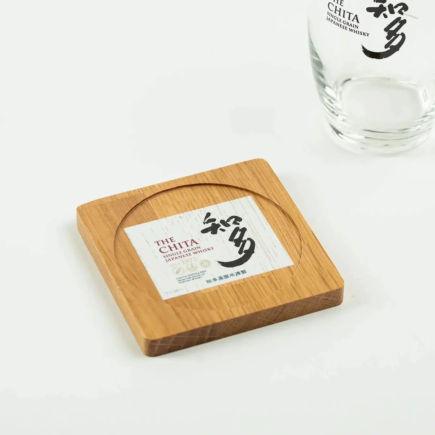 The square The Chita cask oak coaster, featuring the classic Japanese single grain whisky label design.