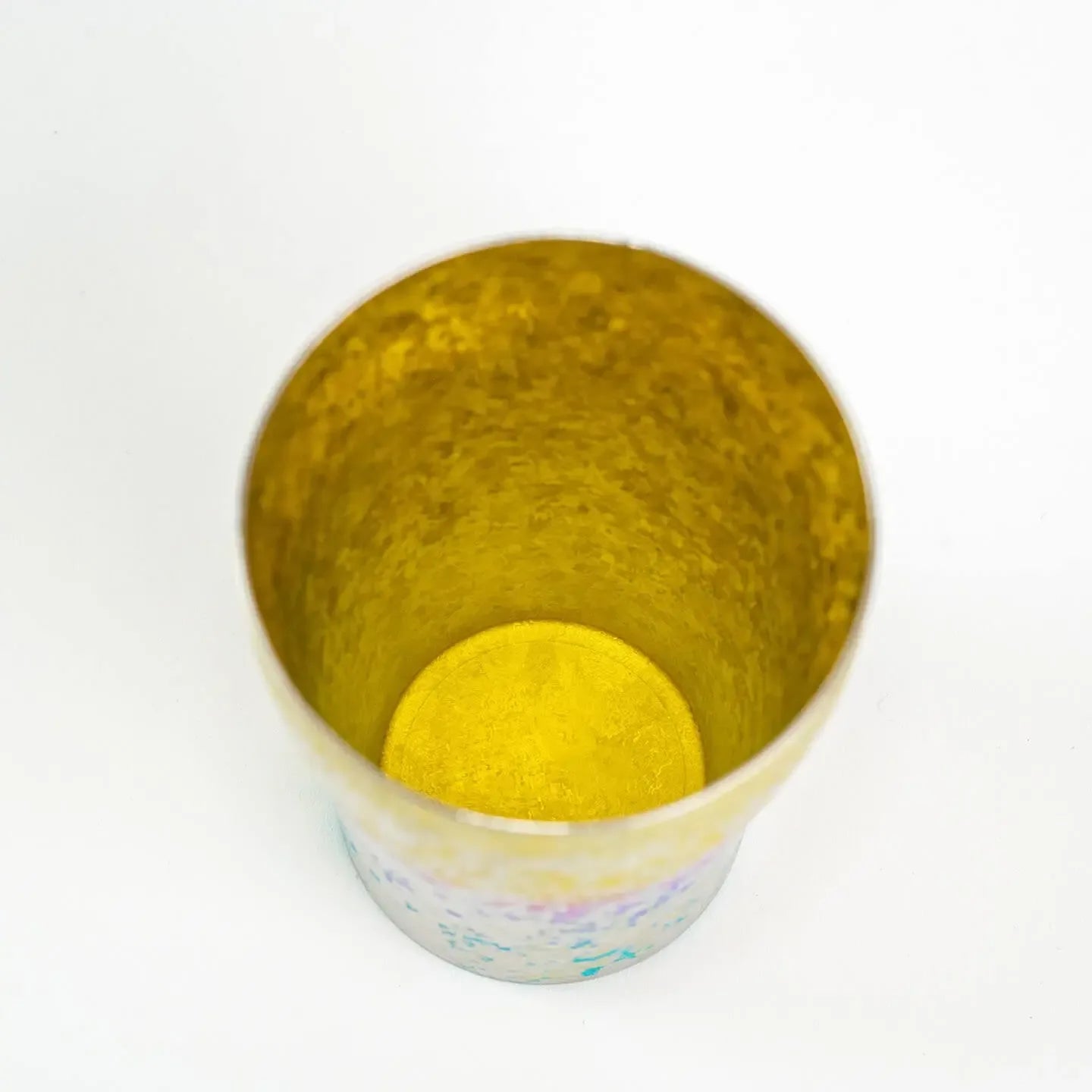 Top-down close-up of the tumbler interior, showcasing the textured, bright golden yellow finish.