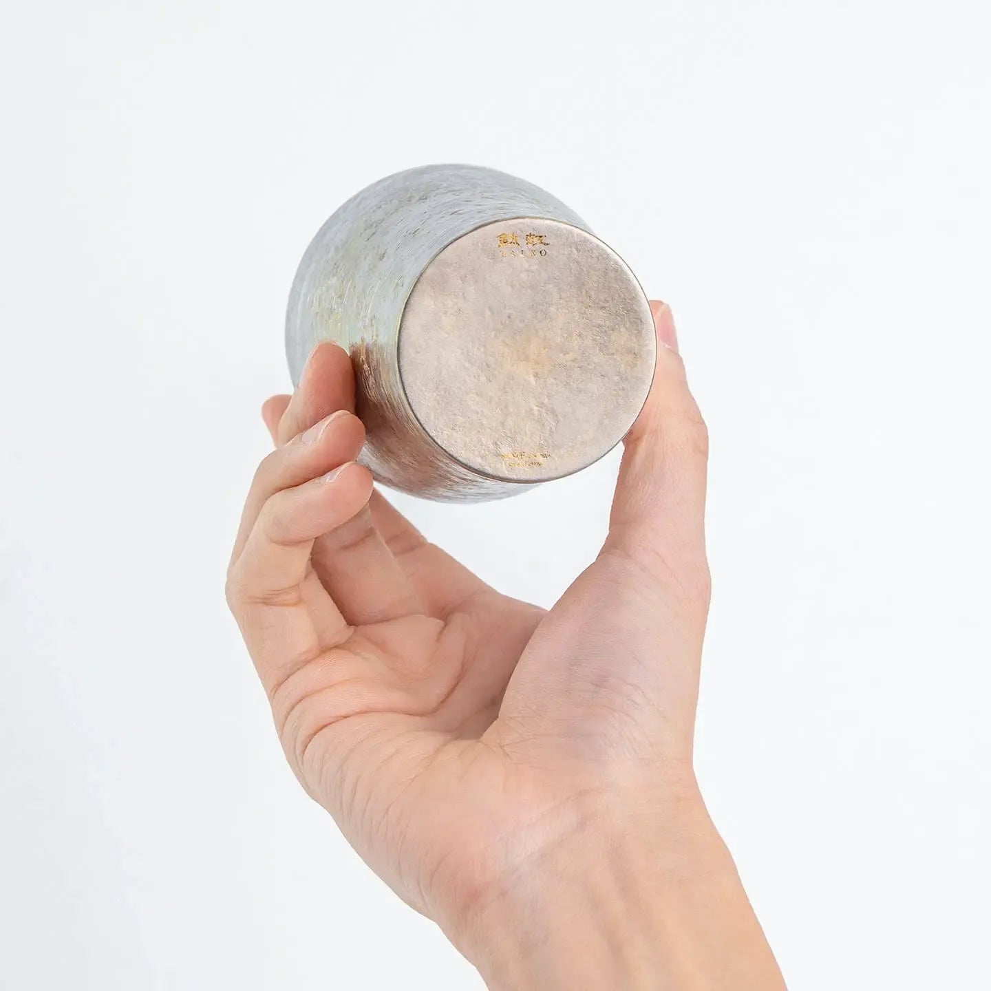 Close-up of the tumbler's bottom, showing the "Taiko" logo and silver texture.