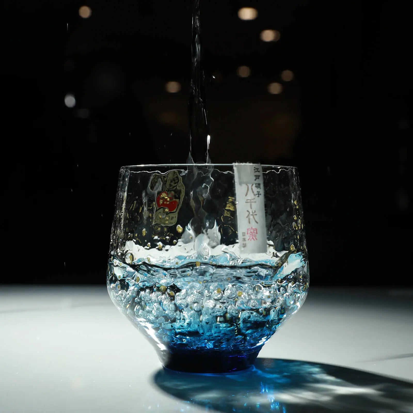 Sake poured in Edo glass 260ml rock tumbler, artisan-made in Japan