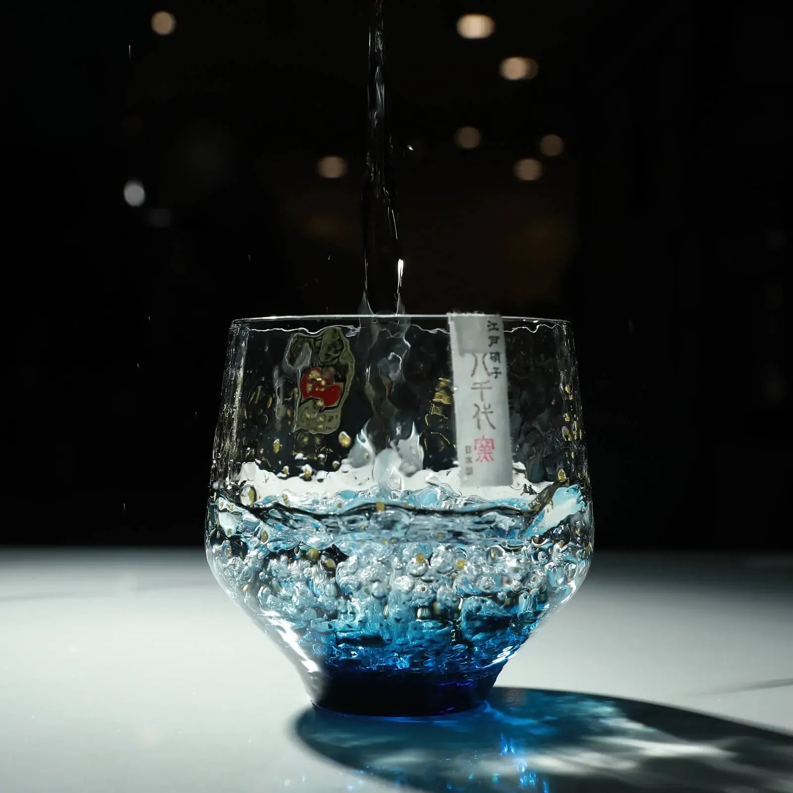 Sake poured in Edo glass 260ml rock tumbler, artisan-made in Japan