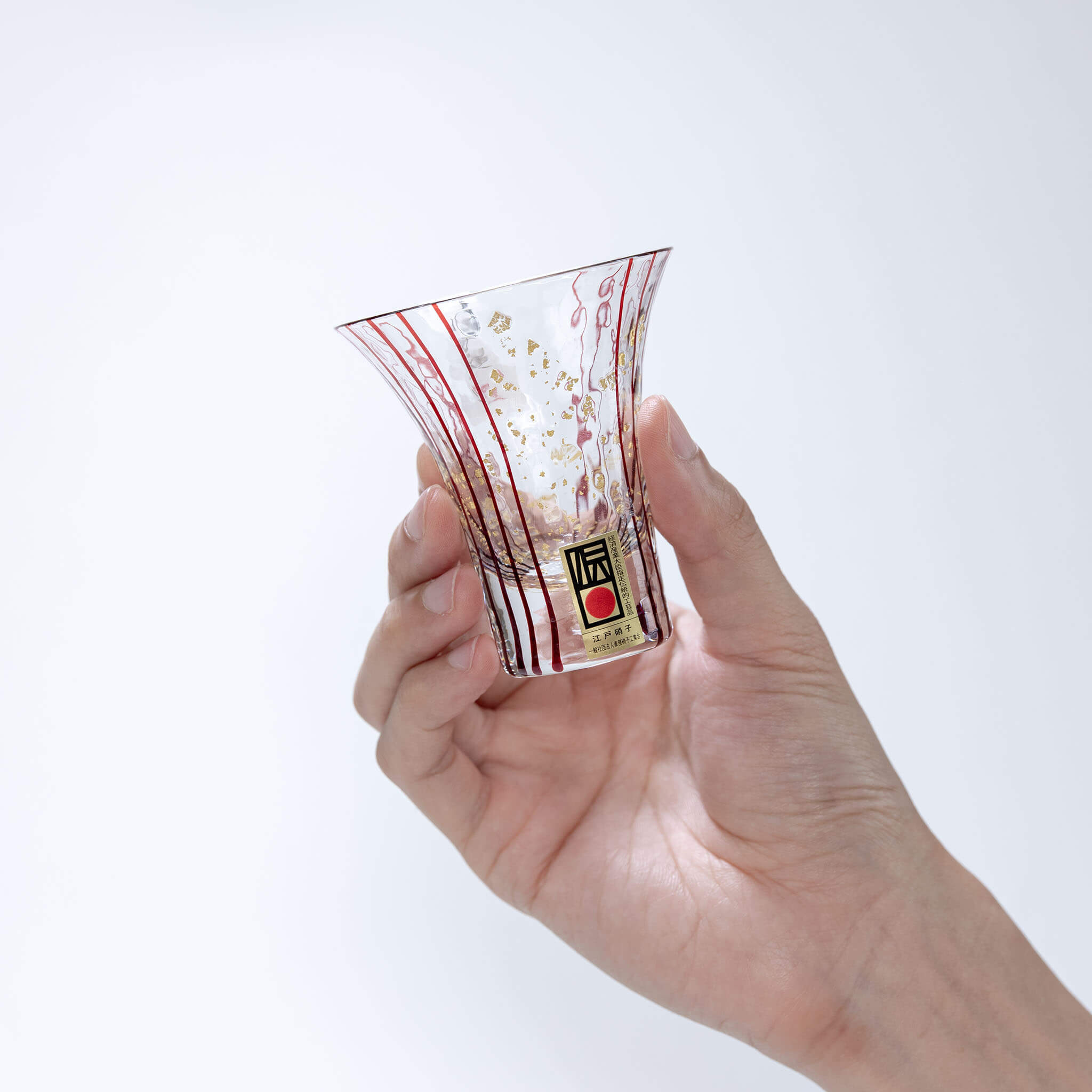 Hand holding a Toyo Sasaki Hanamizake 85ml sake glass