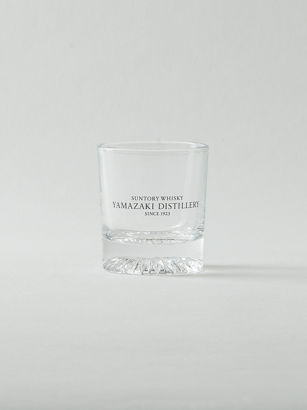 Empty Japanese whiskey shot glass from Yamazaki, front view