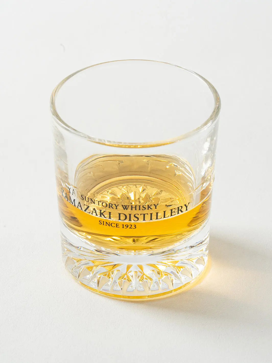Angled view of Yamazaki Distillery 2oz shot glass with neat whisky