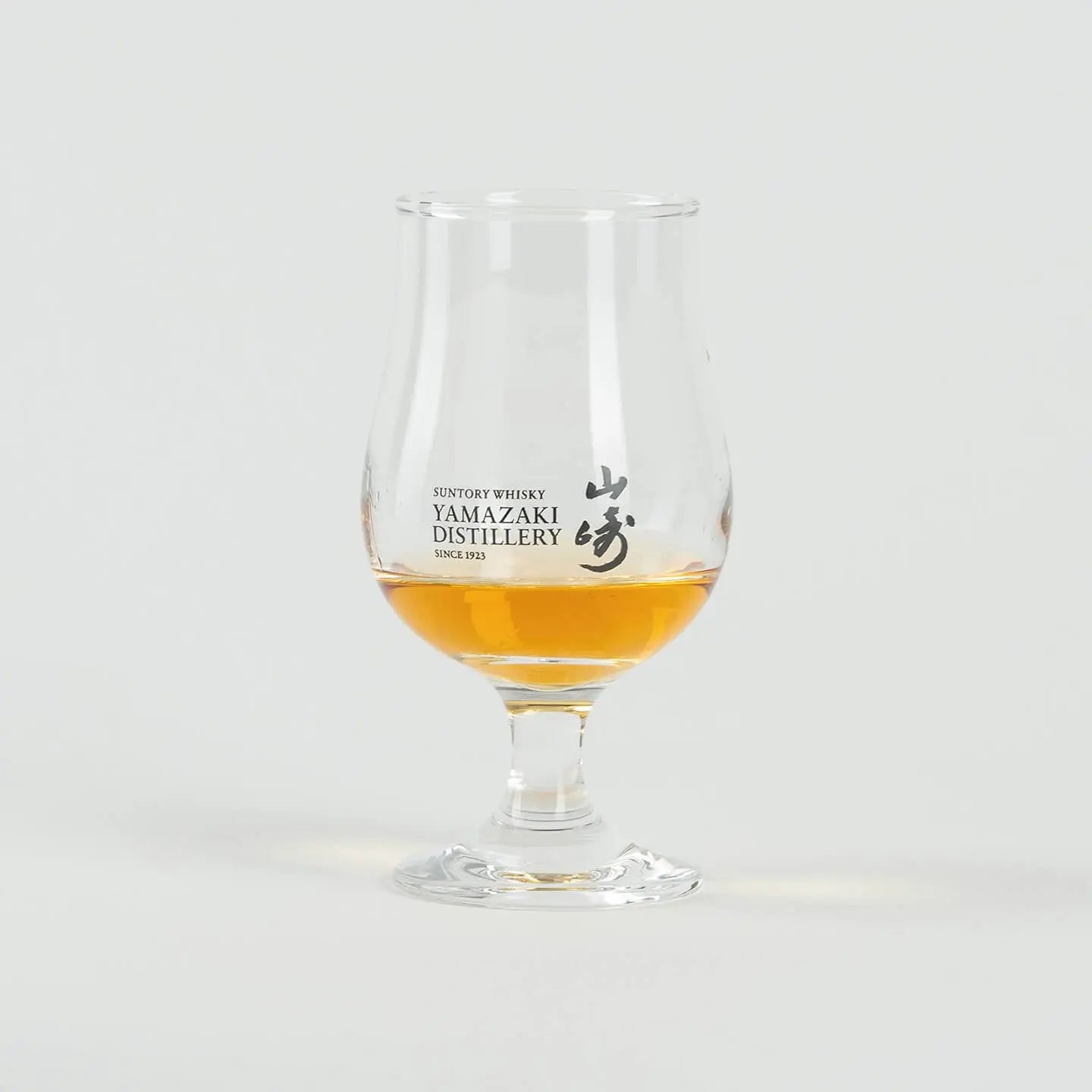 Yamazaki Japanese whiskey tasting glass with whisky, tulip-shaped