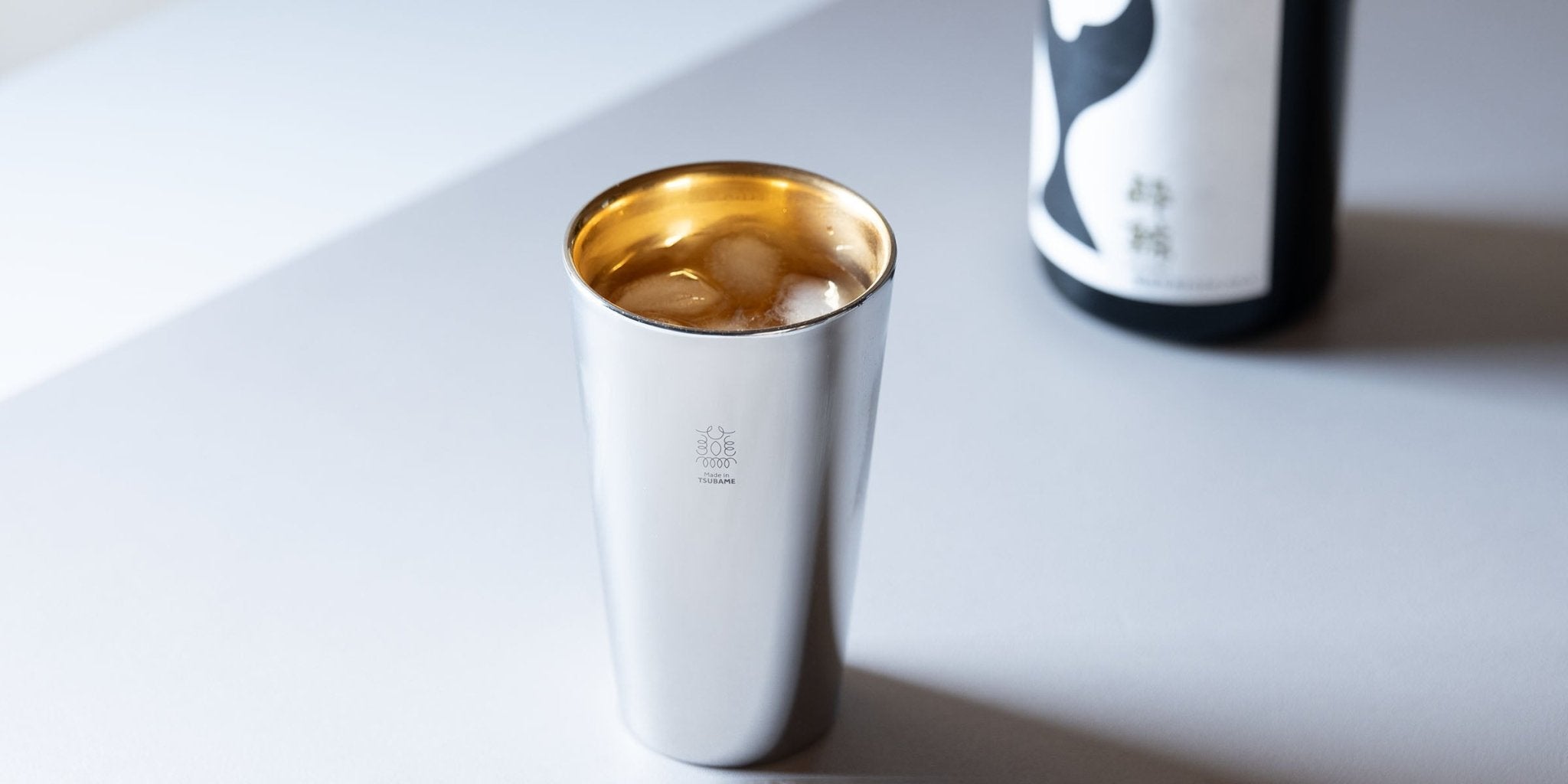 Insulated tumblers keeping iced drinks refreshingly cold during hot summer weather