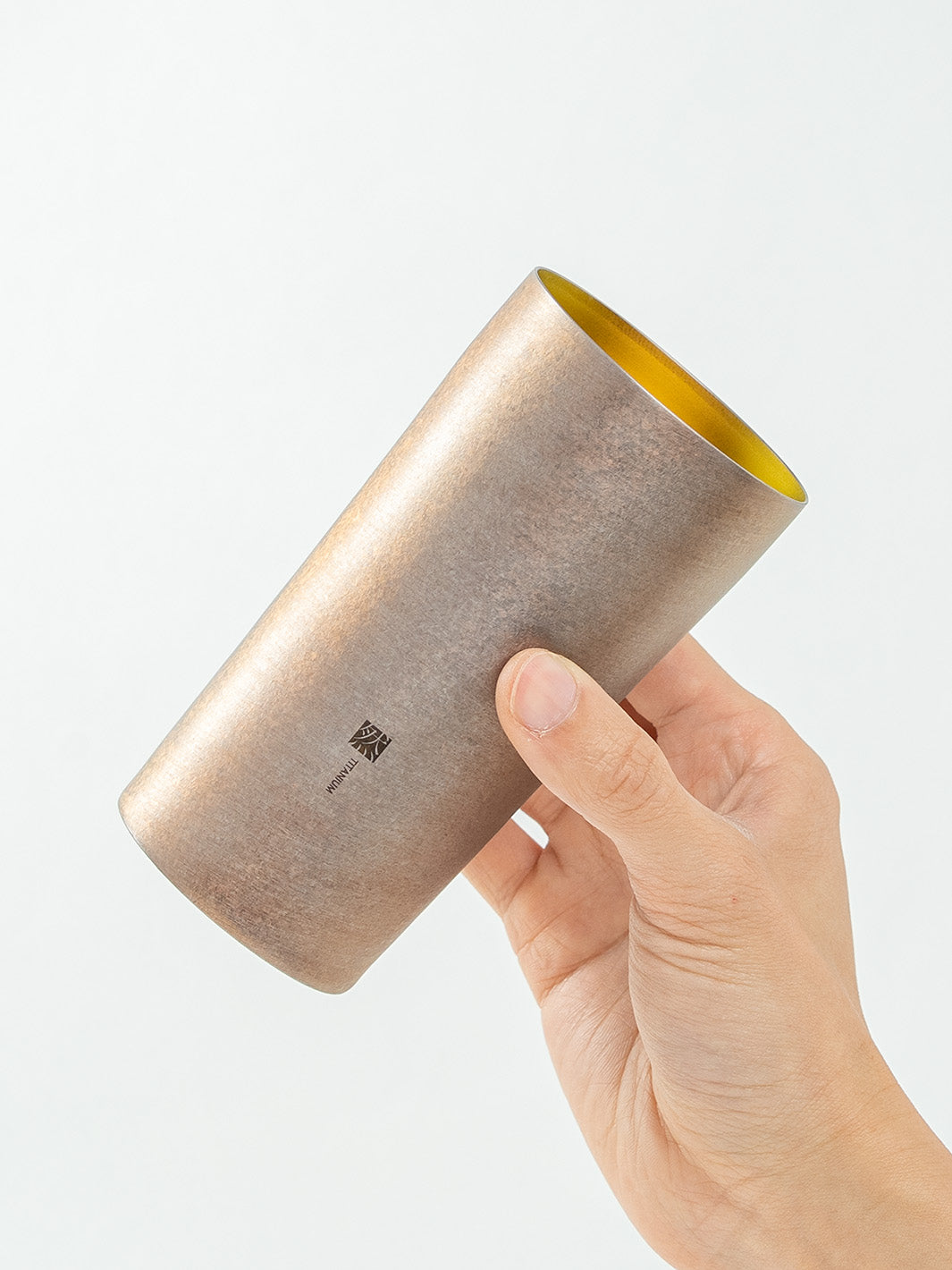  Holding HORIE Zen Series Titanium Tumbler at an Angle
