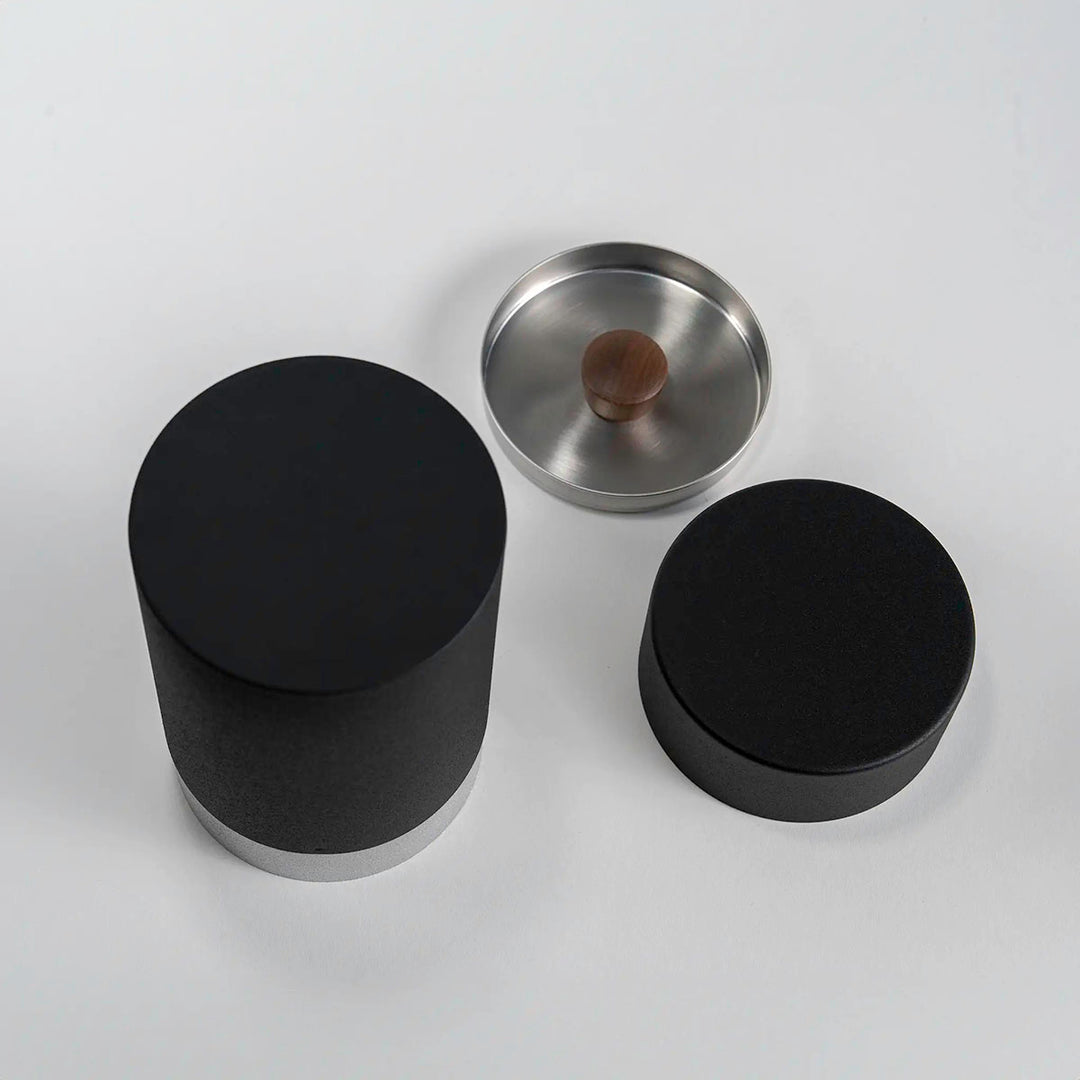 Close-up of the CHAKI Tea Canister - Black, highlighting the wood knob and lid detail