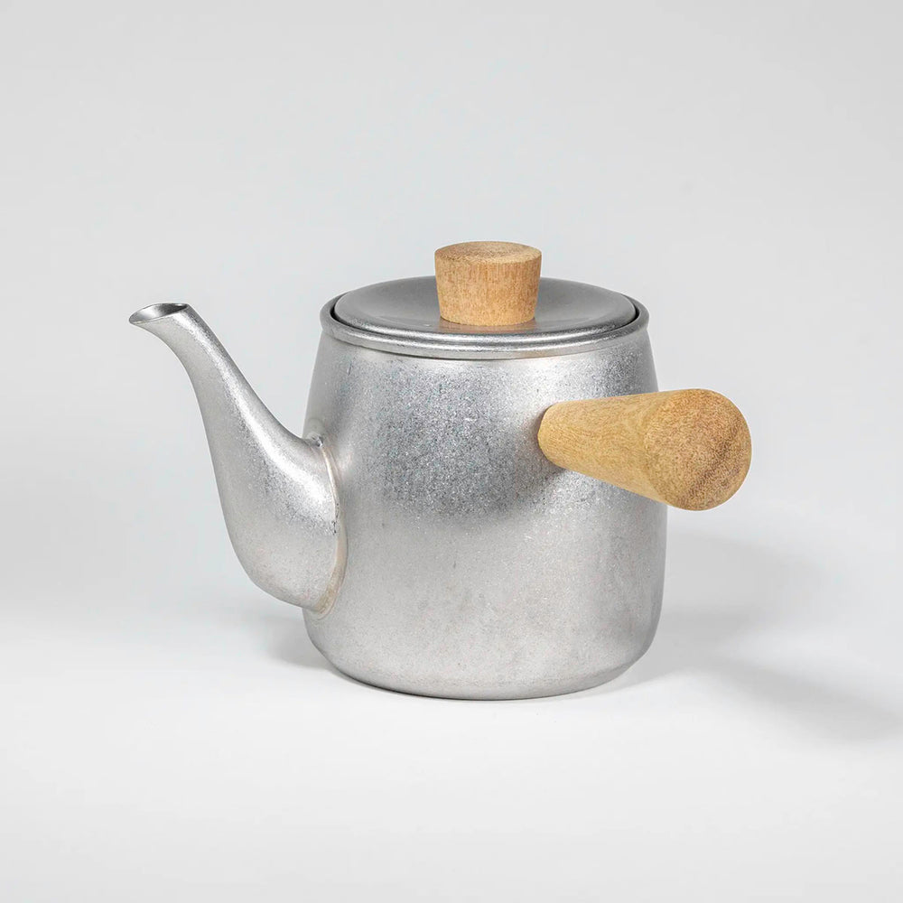 Side view of the stainless steel teapot showing sleek, modern design