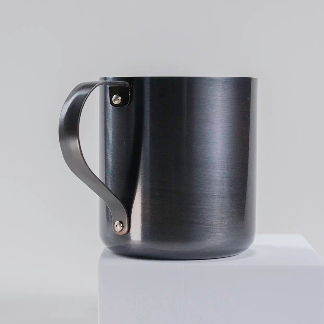 Close-up of the handle on the dark gray copper mug, highlighting the quality craftsmanship.