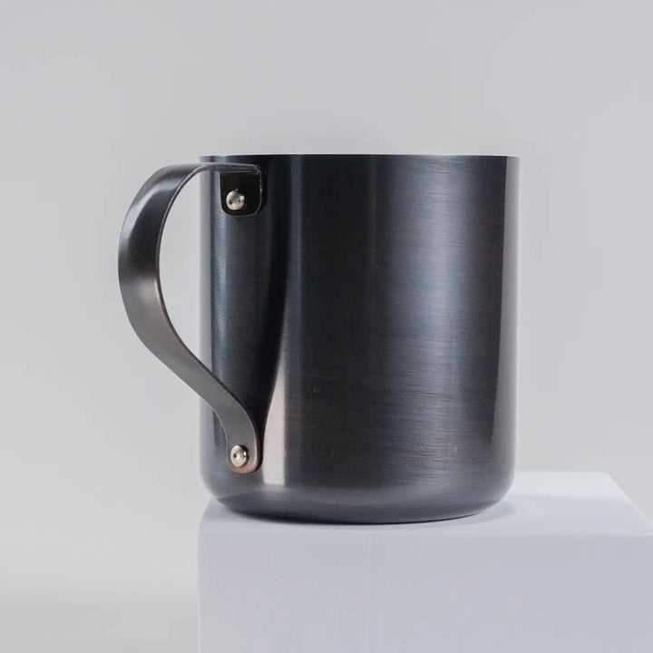 Close-up of the handle on the dark gray copper mug, highlighting the quality craftsmanship.