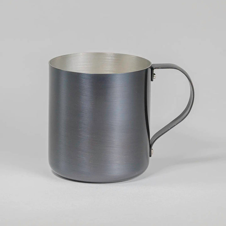 Side view of dark gray copper mug, showcasing its sleek matte finish and elegant design.