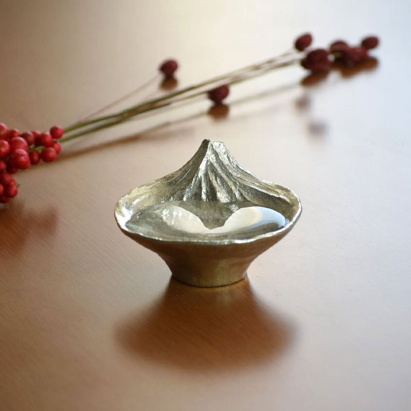 Detailed view of the inverted Mount Fuji design revealed when filled with sake