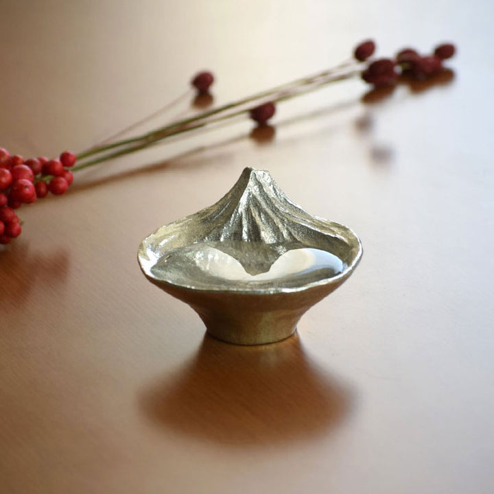 Detailed view of the inverted Mount Fuji design revealed when filled with sake