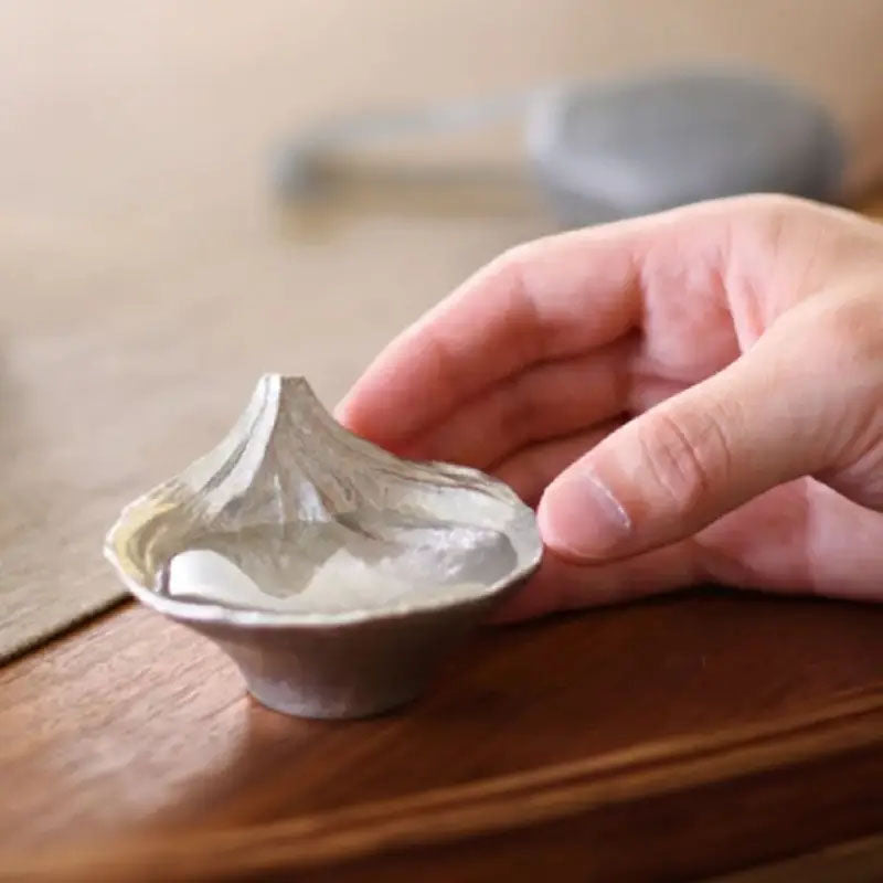 Detailed view of the inverted Mount Fuji design revealed when filled with sake