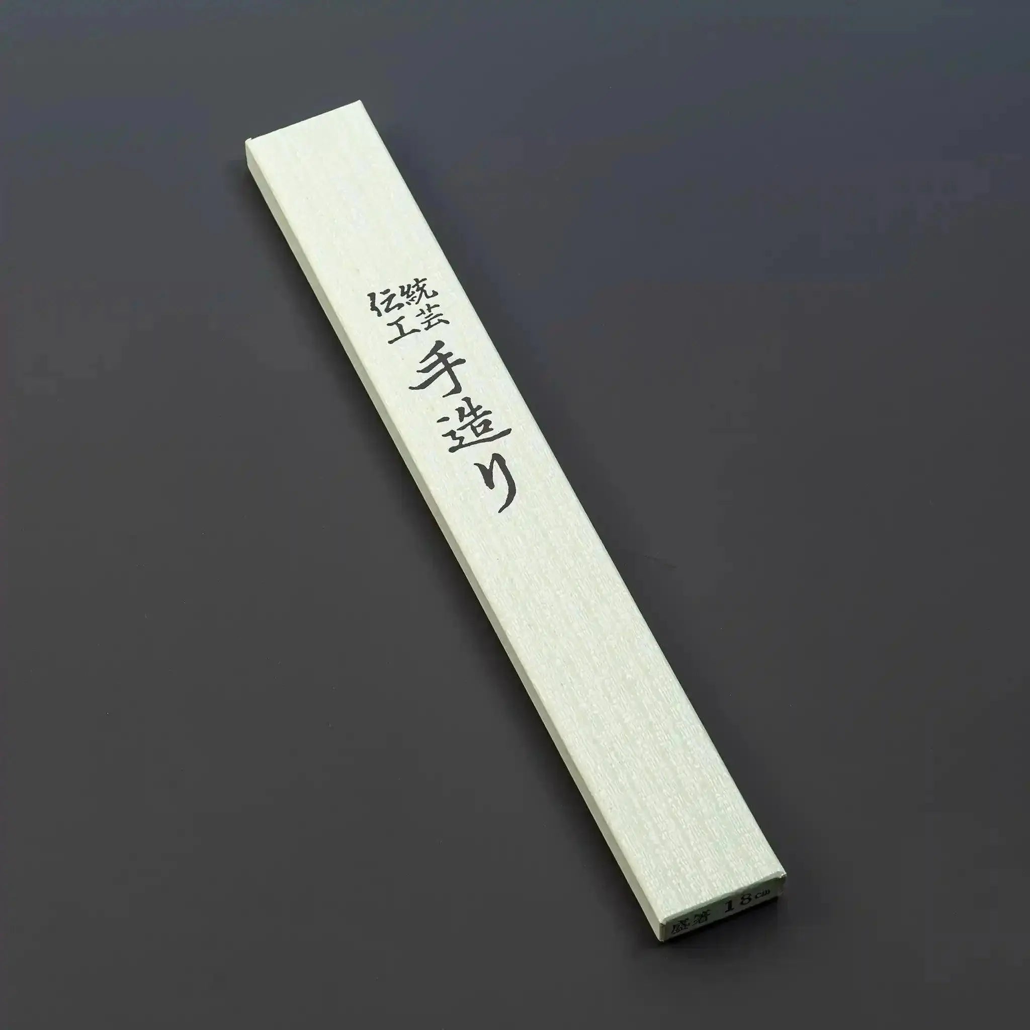 White wood serving chopsticks, 18cm with buffalo horn detail, in packaging.