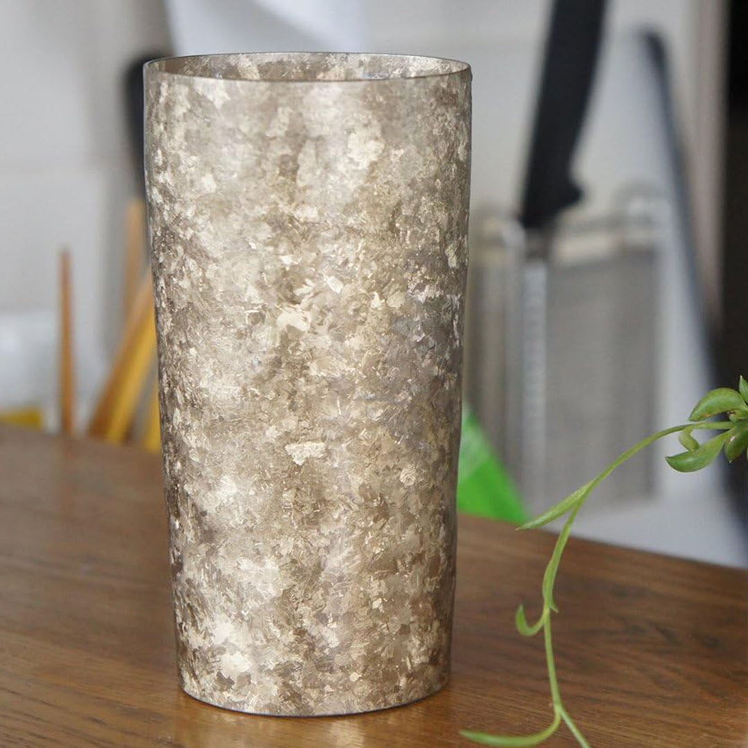 350ml HORIE Kamazukuri Series Double-Walled Titanium Tumbler in silver, elegantly placed in a modern setting, highlighting its sleek design in a real-life scenario.