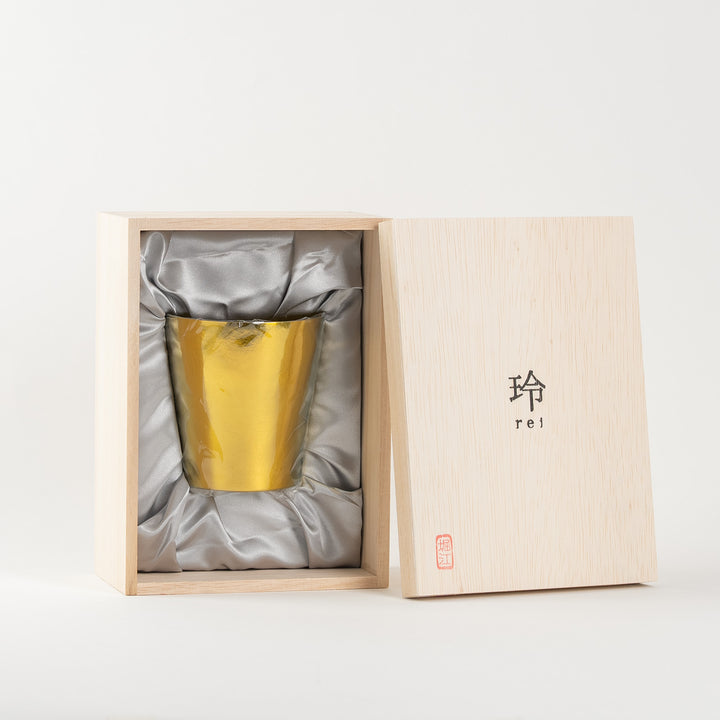 Bright gold HORIE tumbler placed inside gift box