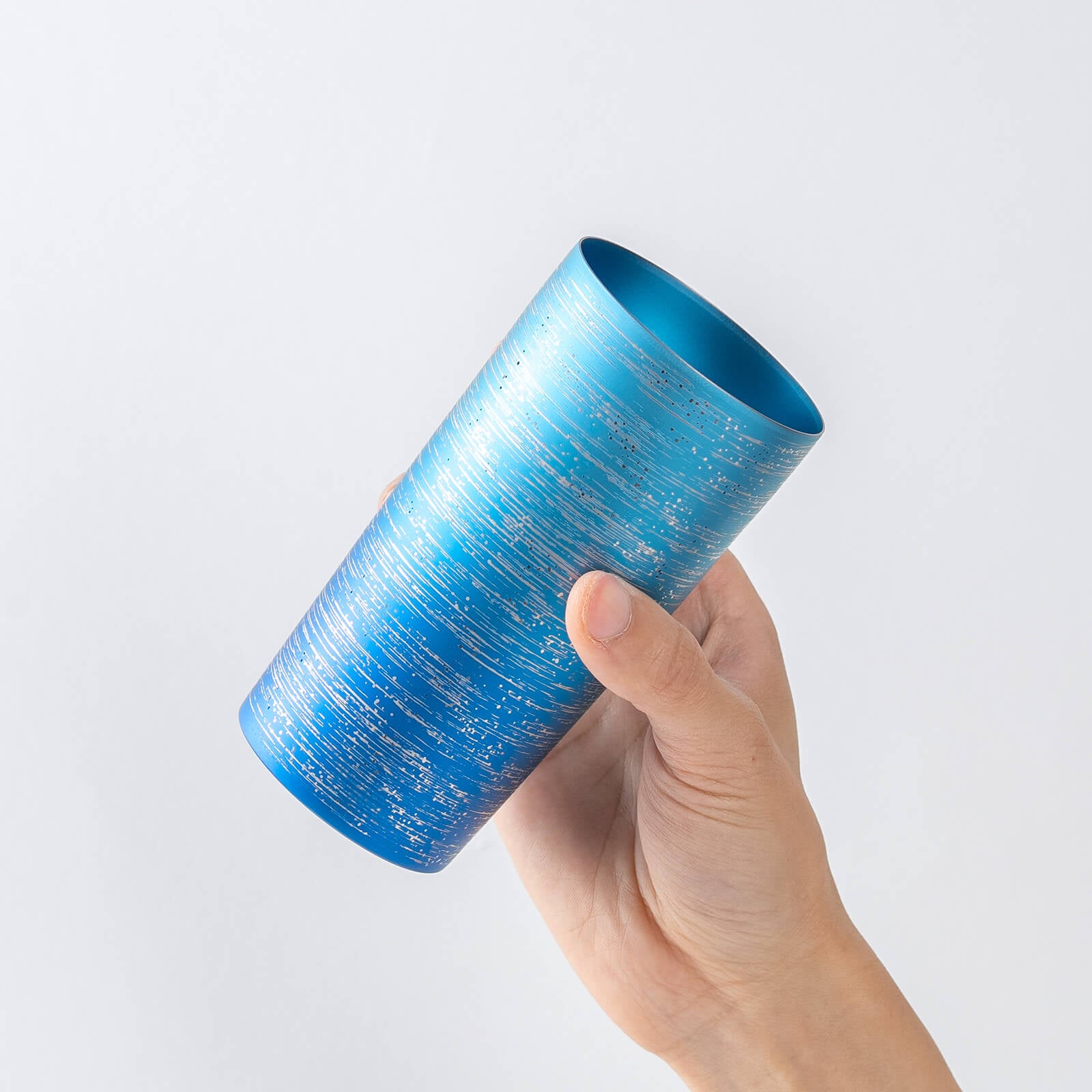 Slightly top-angled view of HORIE Ryo Ocean Blue tumbler (350ml) in hand