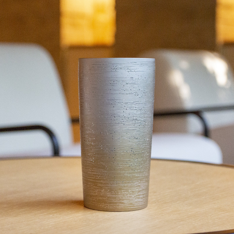 Close-up of HORIE Ryou Series Double-Walled Titanium Tumbler - Brown finish