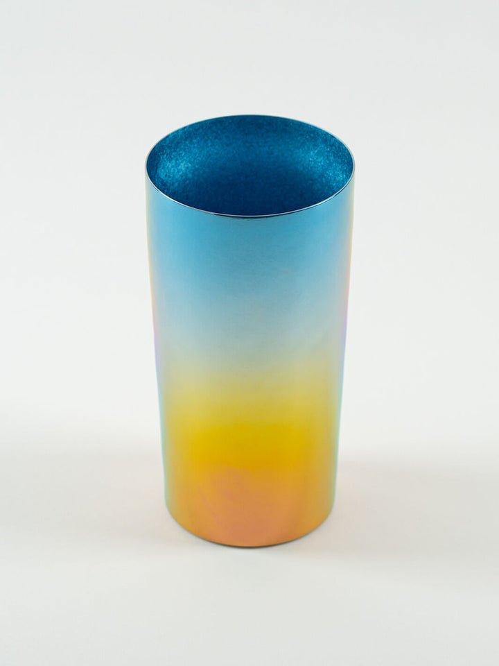 Top-angled view of HORIE Saiko rainbow titanium tumbler (350ml), showing vibrant gradient