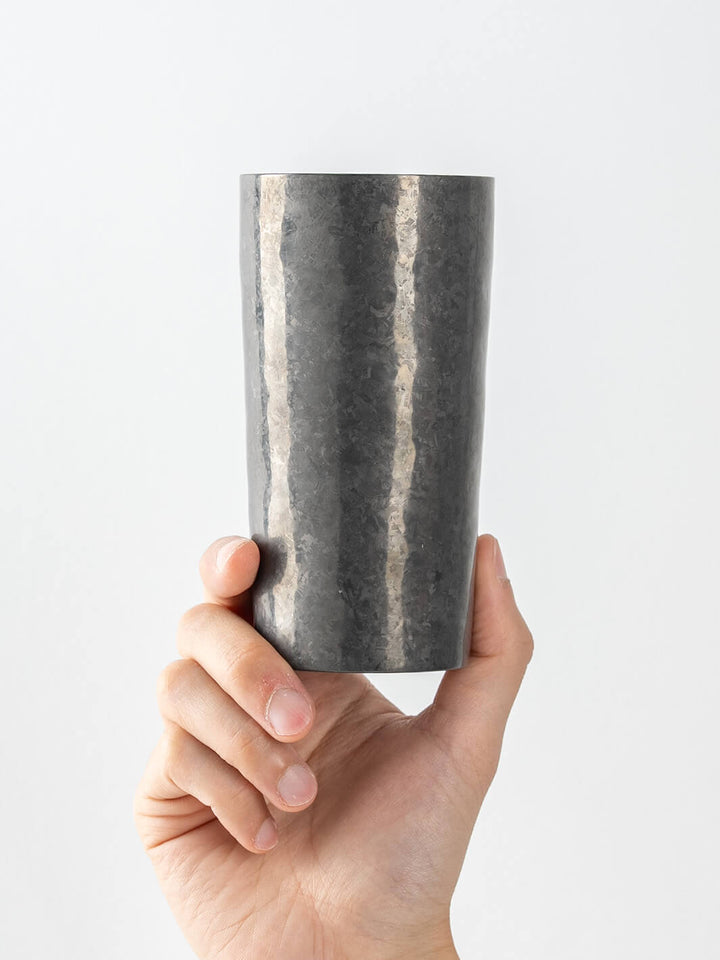 Black HORIE titanium tumbler (handheld, front view)