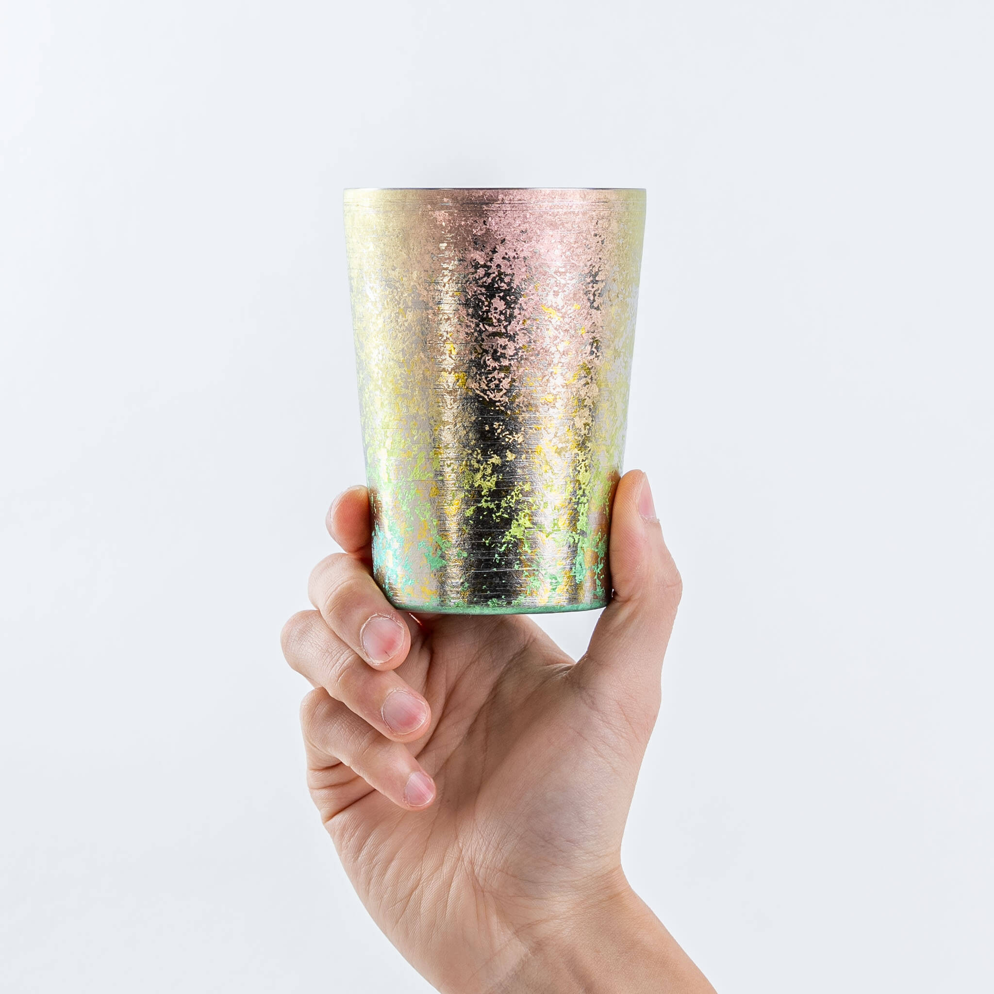 Hand holding a HORIE Taiko 400ml pink titanium tumbler