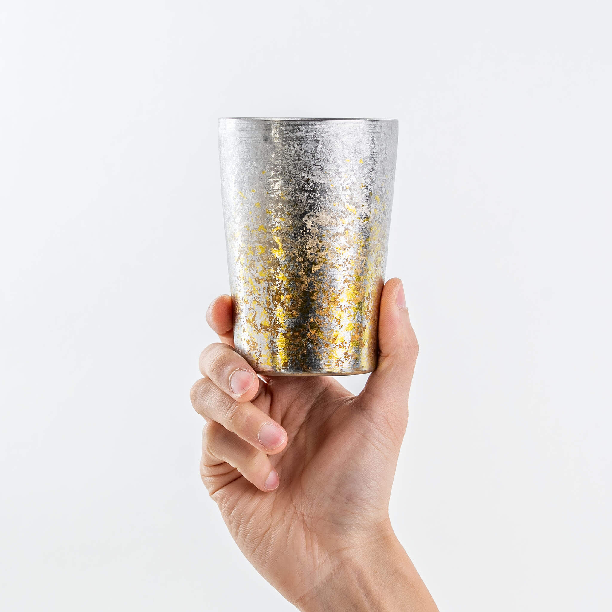 Hand holding a HORIE Taiko 400ml silver titanium tumbler