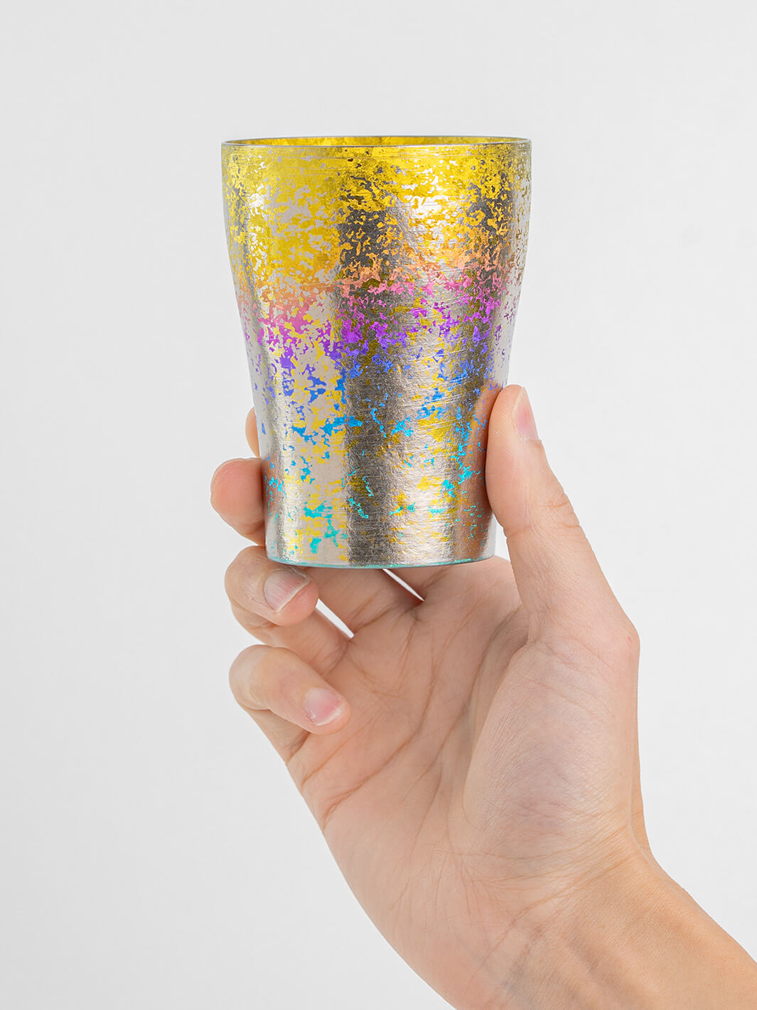Rainbow titanium tumbler held from front, 250ml