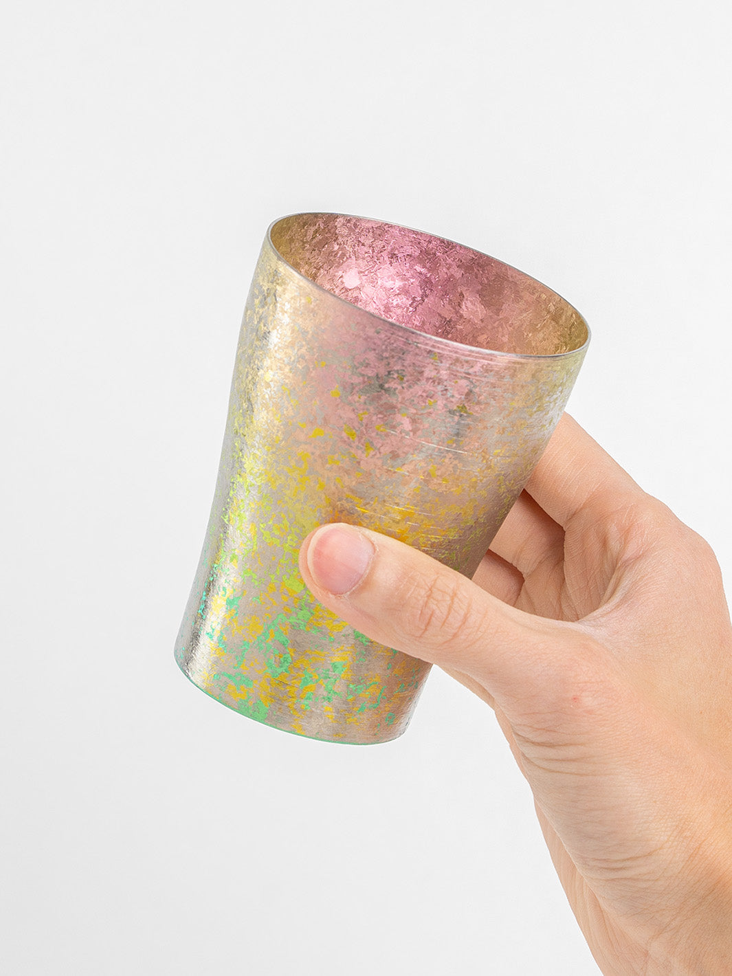 Side view of pink tumbler in hand