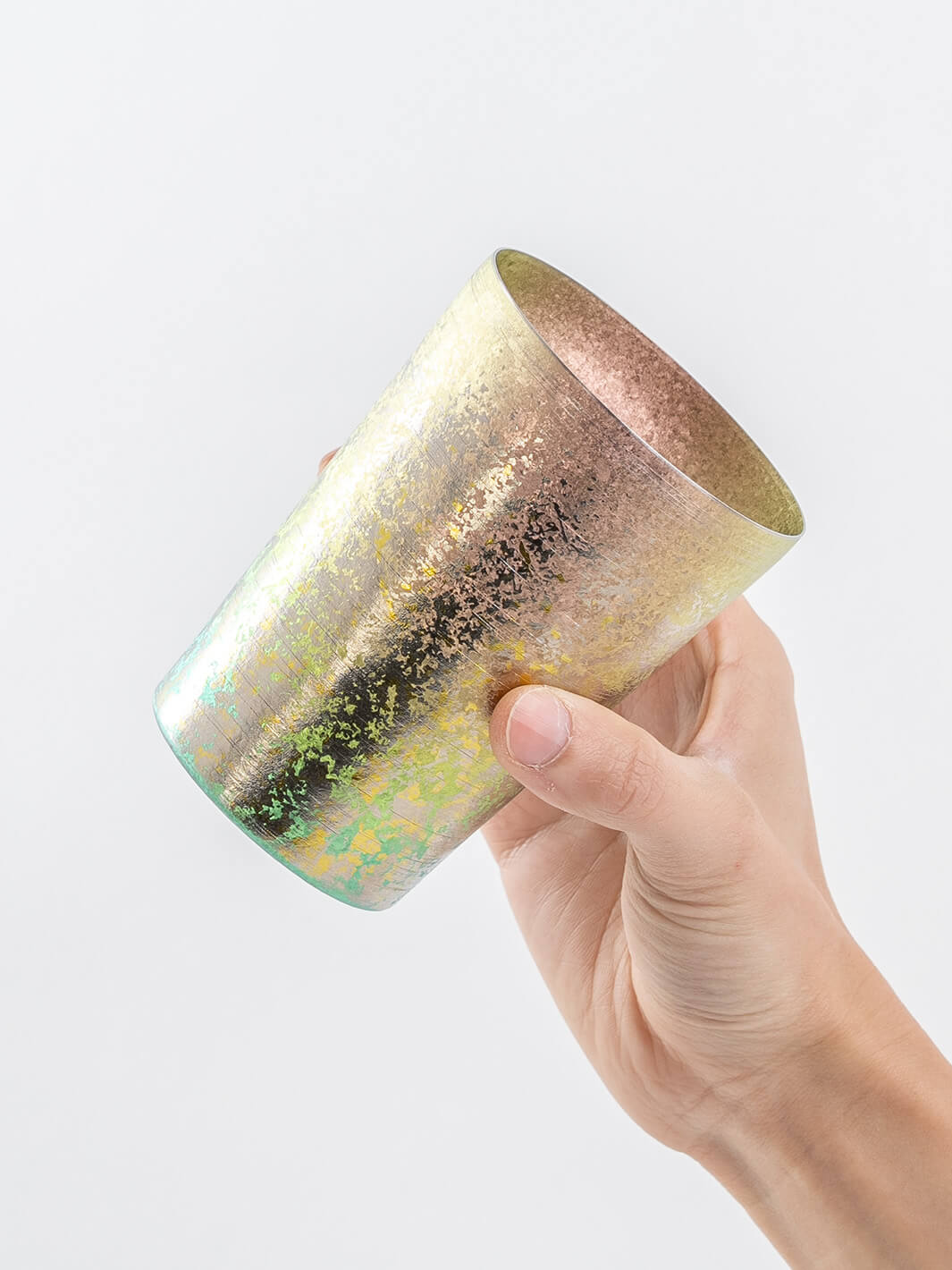 Side view of pink HORIE tumbler in hand