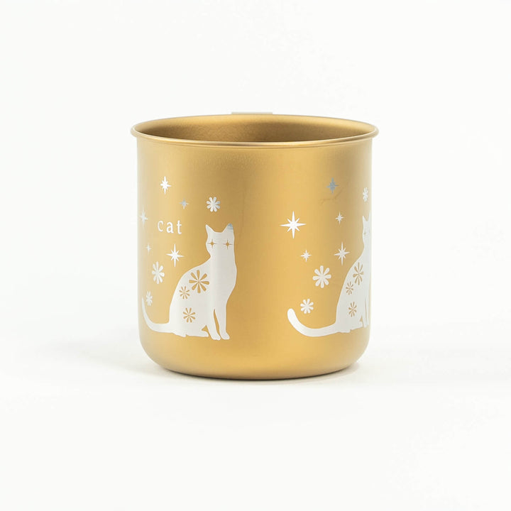 Side view of HORIE titanium cat mug in gold