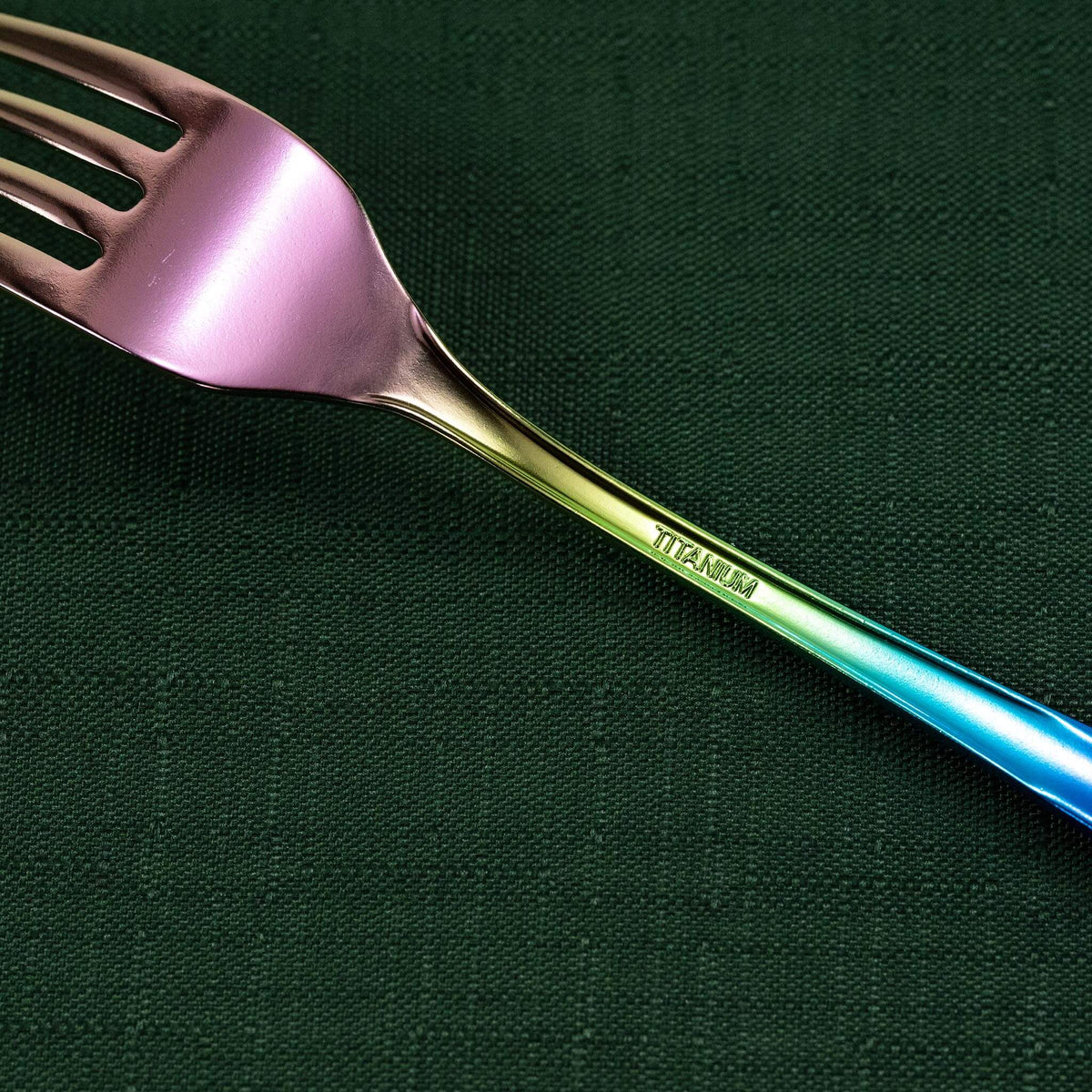 Close-up of the rainbow HORIE pure titanium dessert fork