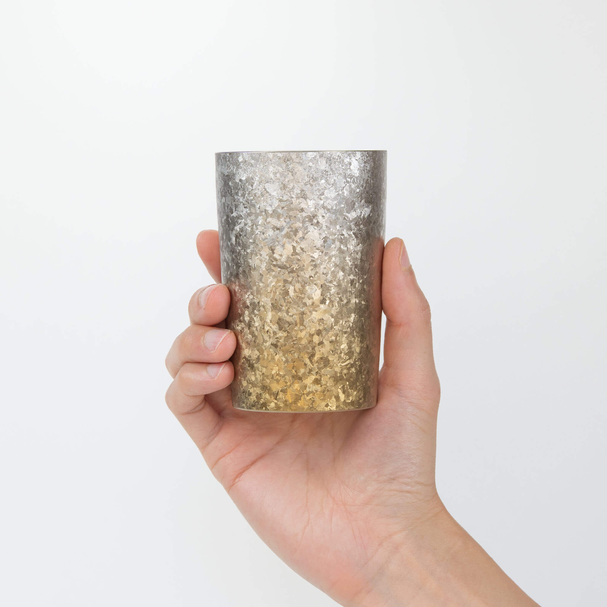 HORIE Titanium Kamazukuri 270ml Gold Silver Tumbler held upright in hand, front view