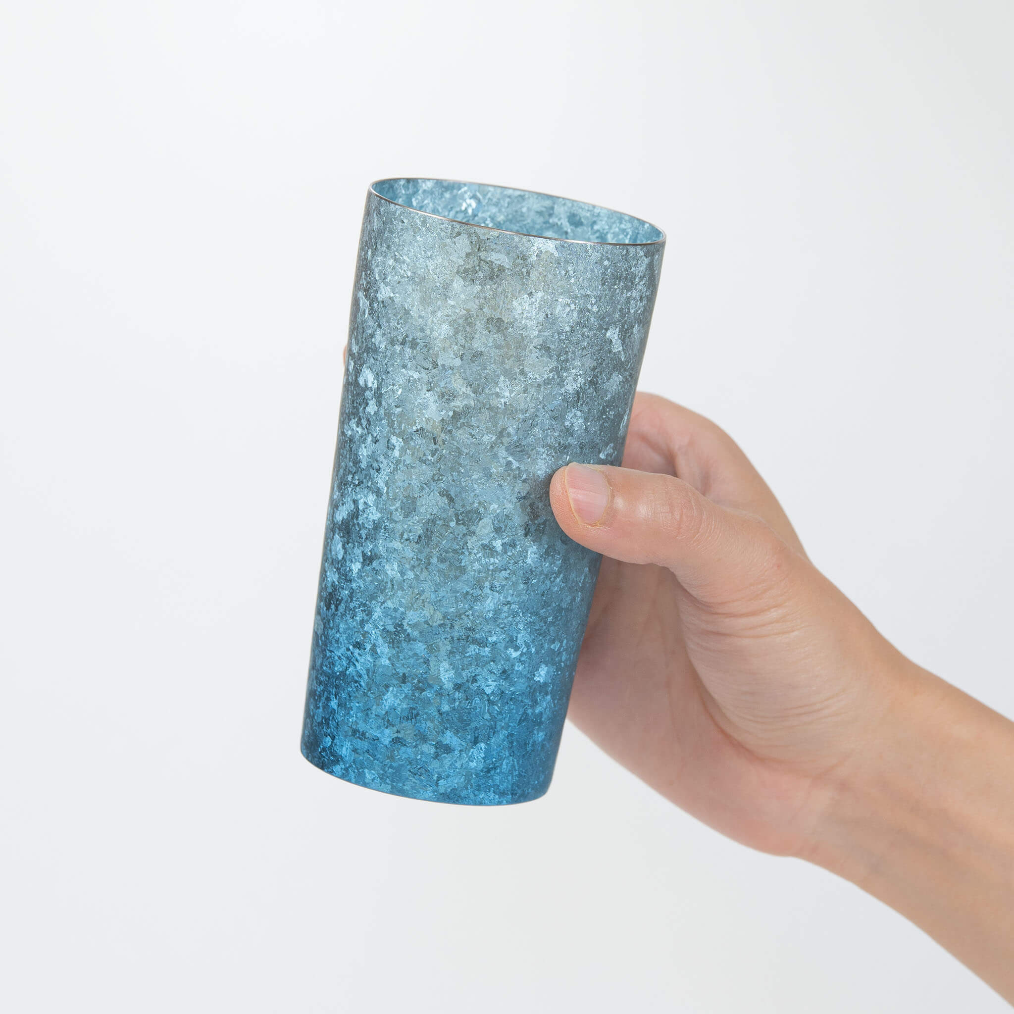 HORIE Titanium Kamazukuri 350ml Blue Tumbler tilted in hand showing interior and kiln-fired blue texture