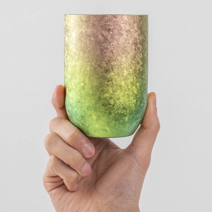 Hand holding the HORIE Kamazukuri Titanium Tumbler Pink