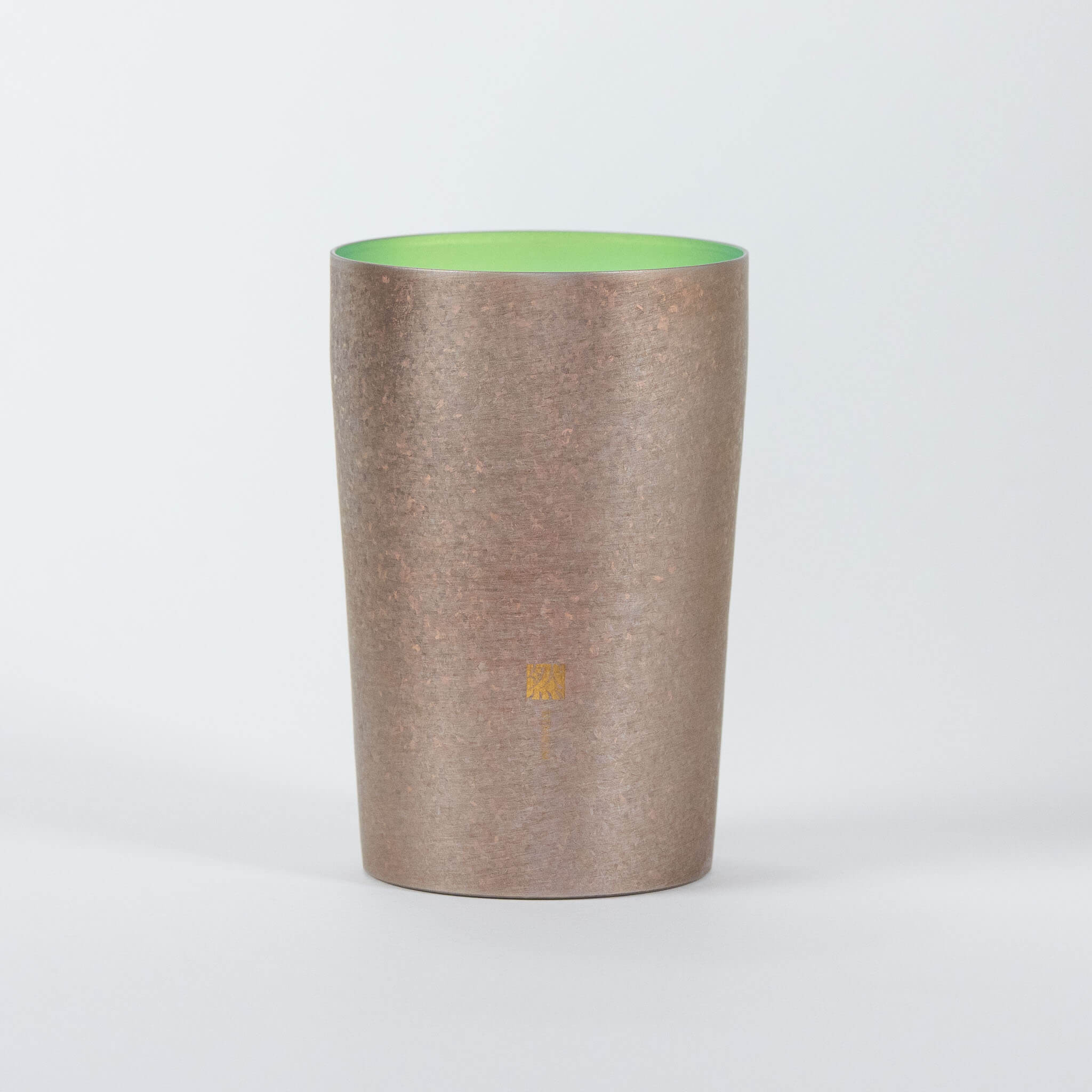 The Horie Zen titanium tumbler in its wooden gift box, displayed with the official Japanese product manual and care instructions.