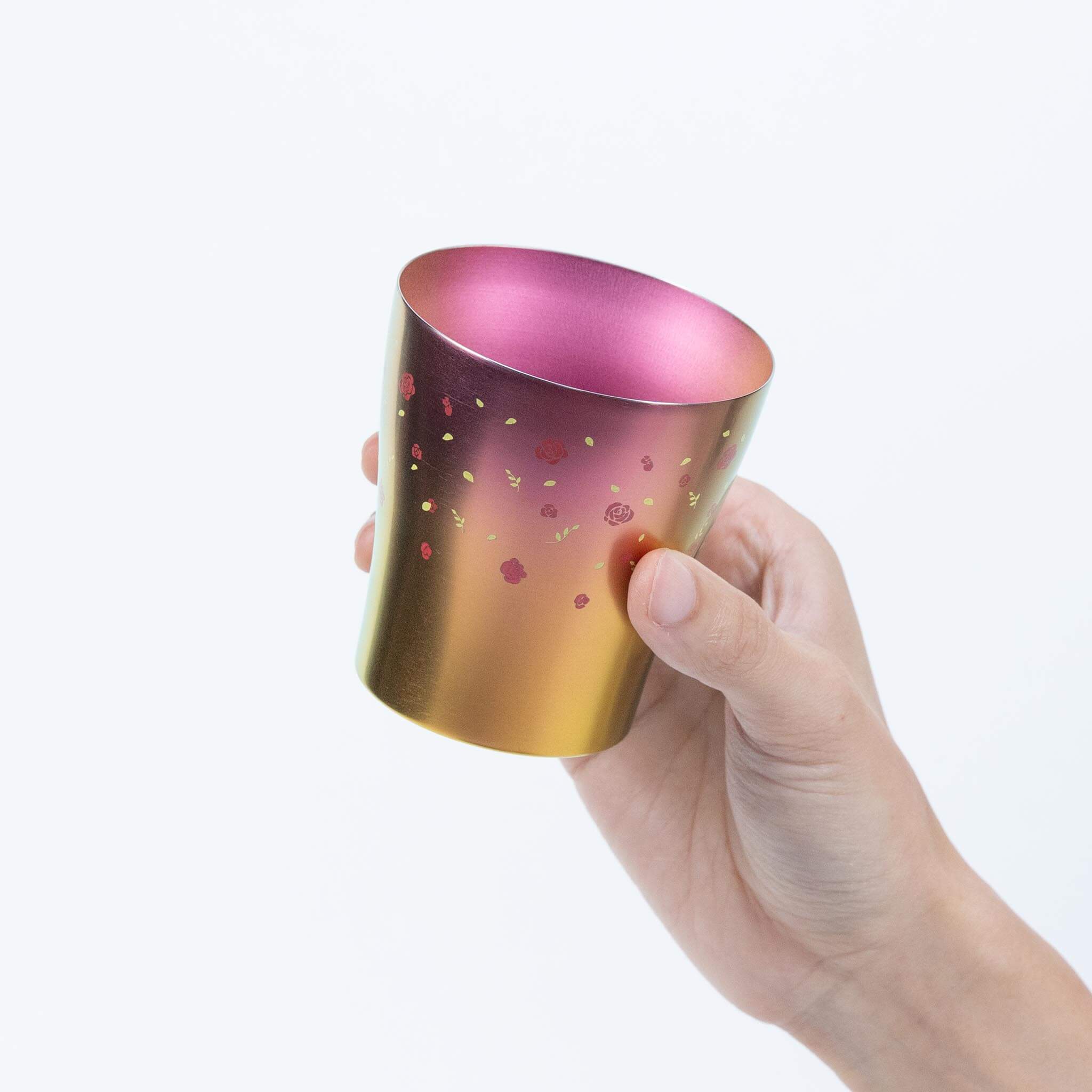 Side view of the blue HORIE Hana titanium tumbler held by hand
