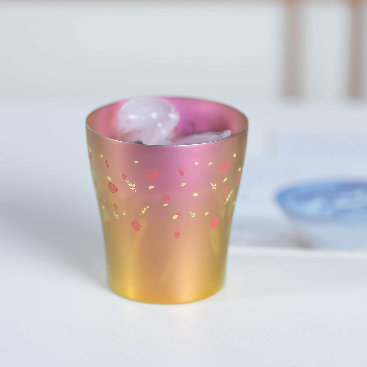 Pink HORIE Hana Series titanium tumbler filled with ice