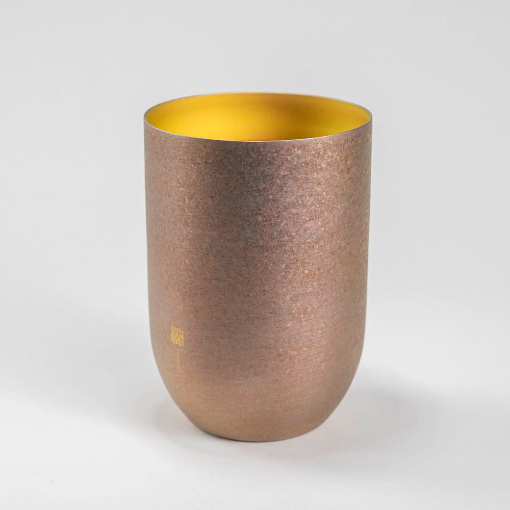 Side view of the gold HORIE Zen Series Double-Walled Titanium Tumbler, highlighting its smooth finish and minimalist aesthetic.