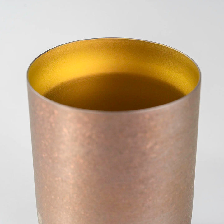 Close-up of the gold finish on the HORIE Zen Series 400ml Double-Walled Titanium Tumbler, emphasizing its durable and premium material.