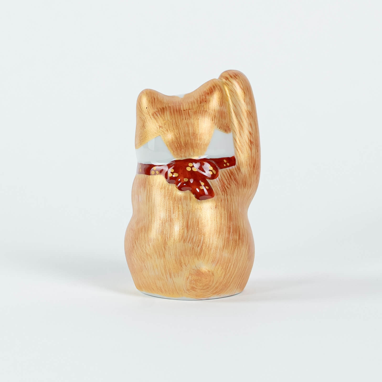 Back view of 10cm Kutani-yaki lucky cat, hand-painted ceramic figurine.