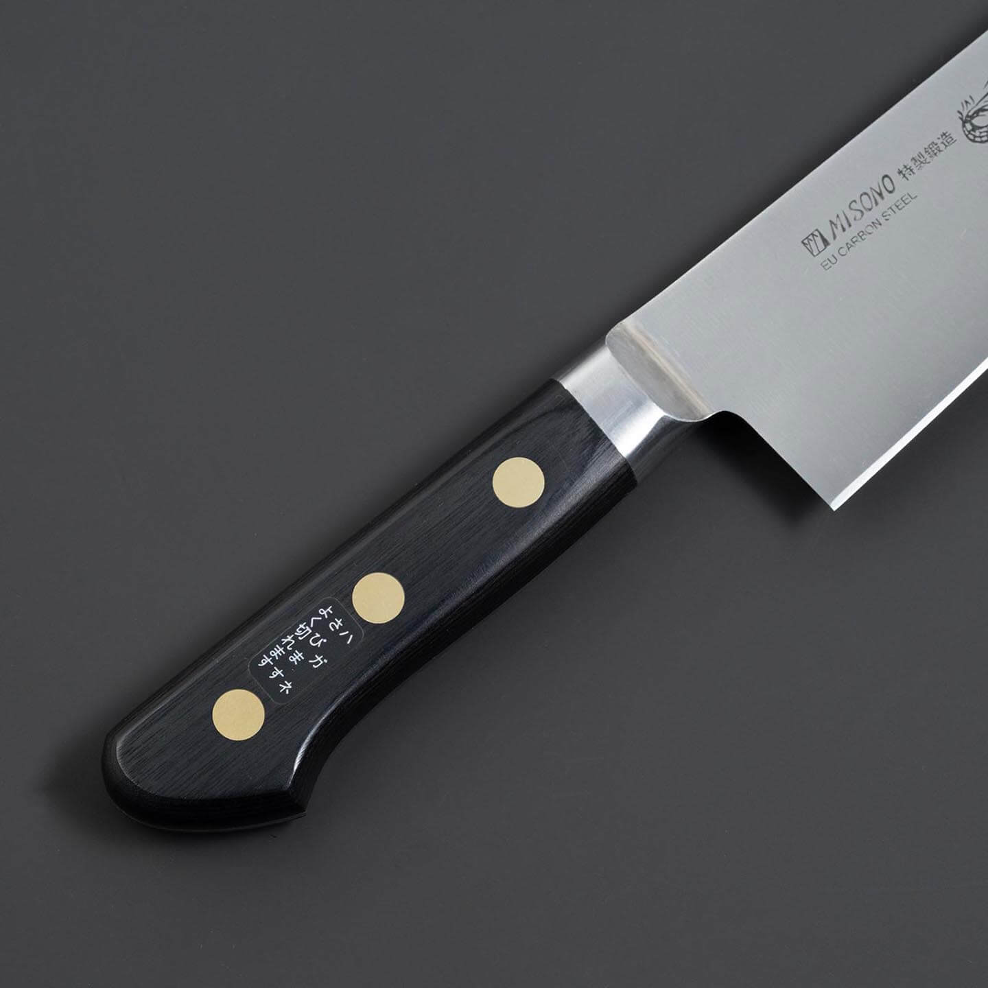 Front view of the riveted black handle on the Misono Swedish carbon steel chef knife