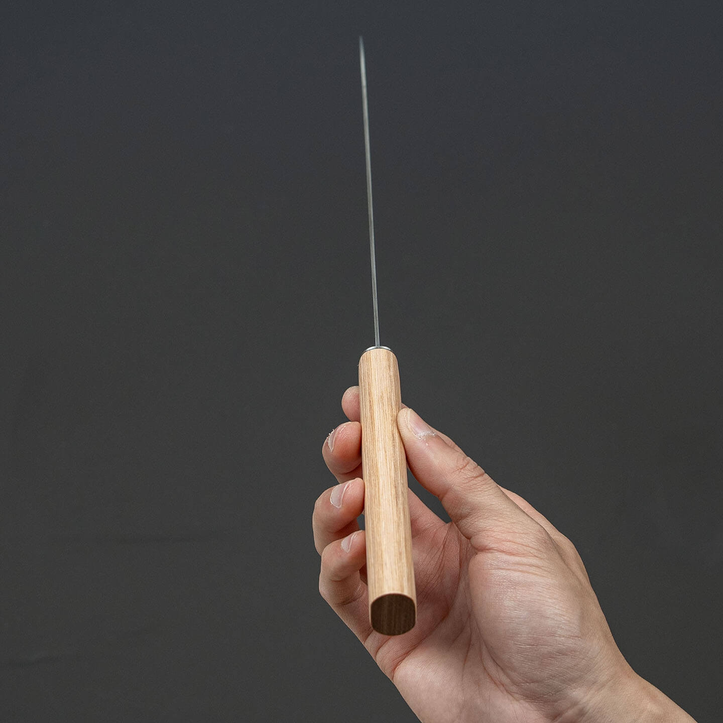 Spine view of the Shizu Hamono 190mm chef knife showing its blade profile