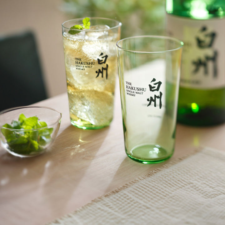 Suntory Hakushu Thin-Walled Tumbler on a table, showing whiskey filled inside