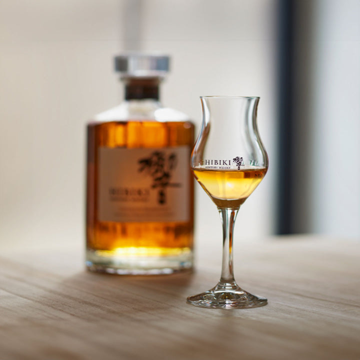 Side view of the Suntory Hibiki Tasting Glass - 105ml, showcasing the elegant stem and tulip shape.