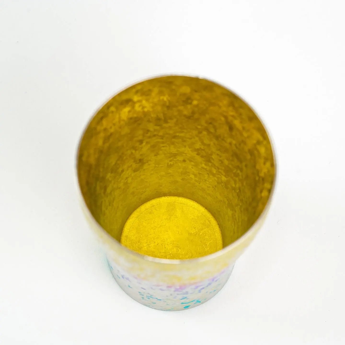 Top-down close-up of the tumbler interior, showcasing the textured, bright golden yellow finish.