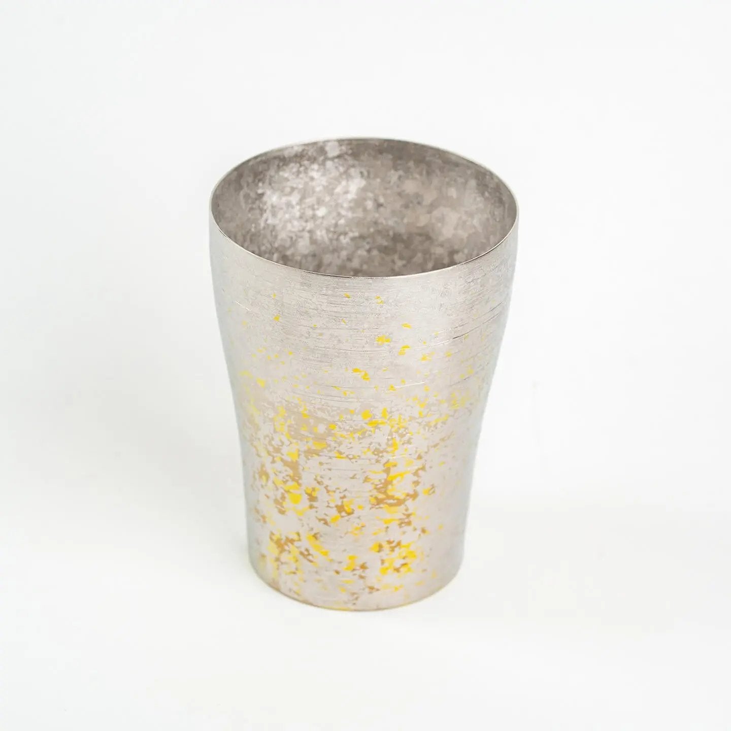 Silver titanium Taiko Series tumbler with yellow color pops, photographed from a slight angle.