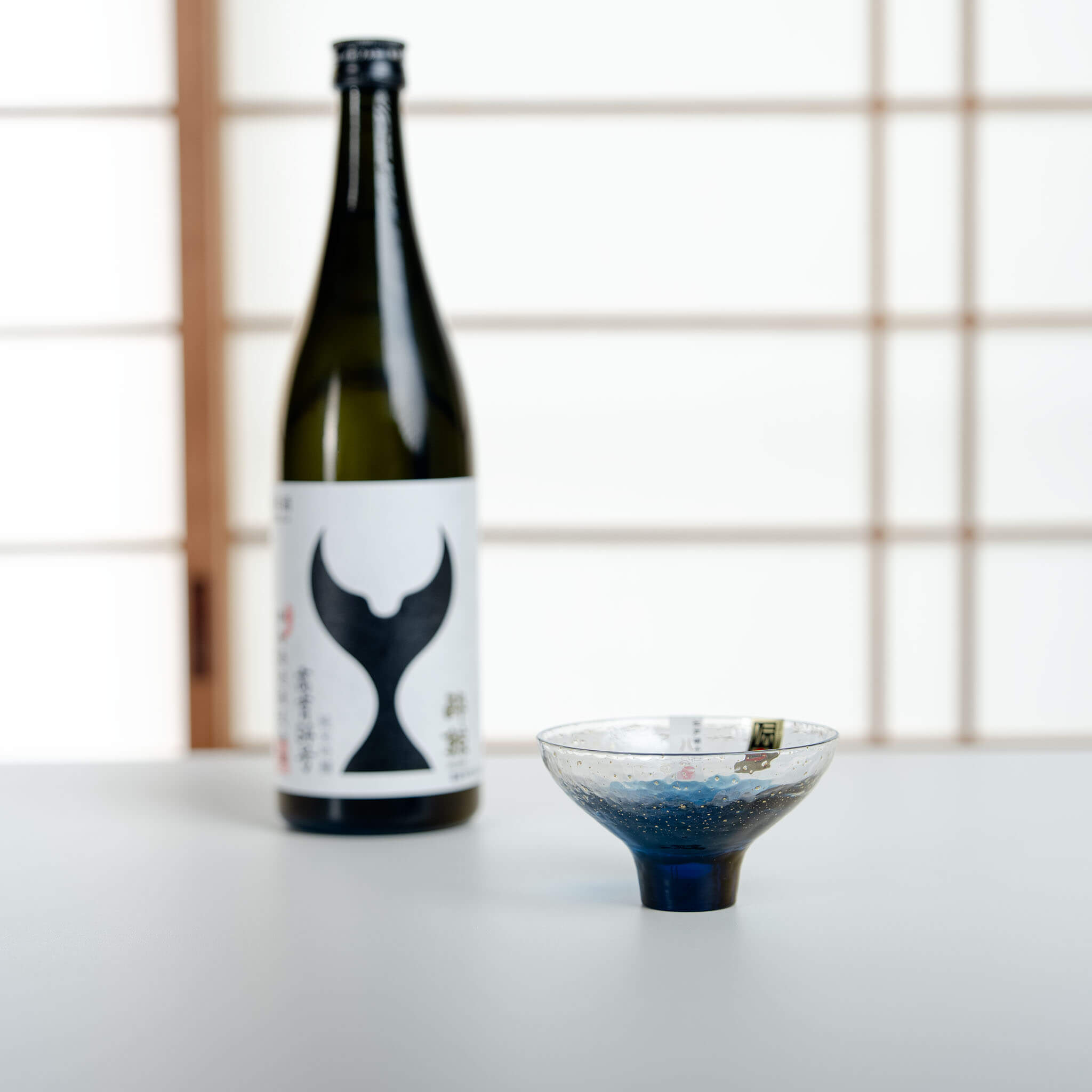 Toyo Sasaki blue Edo glass sake cup in a Japanese sake serving setting