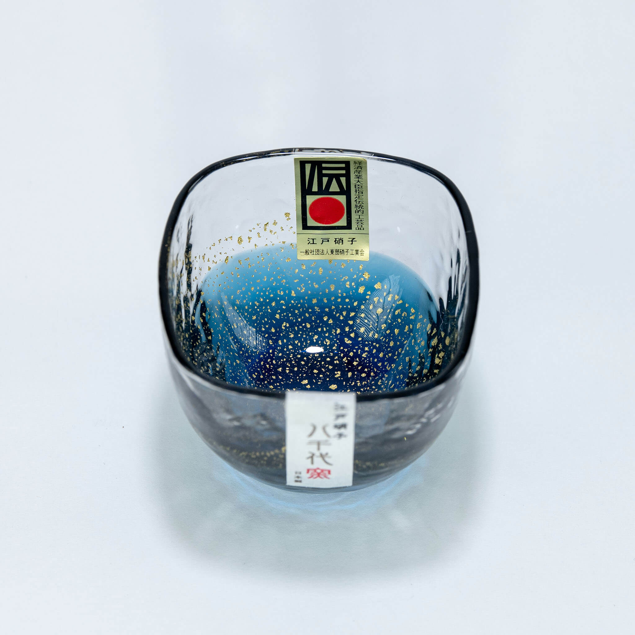 Top view of Yachiyo Kiln 60ml sake cup with blue glass and gold flecks